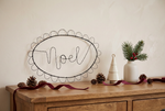 Load image into Gallery viewer, Noel sign styled with a small cream ceramic Christmas tree instead of the book
